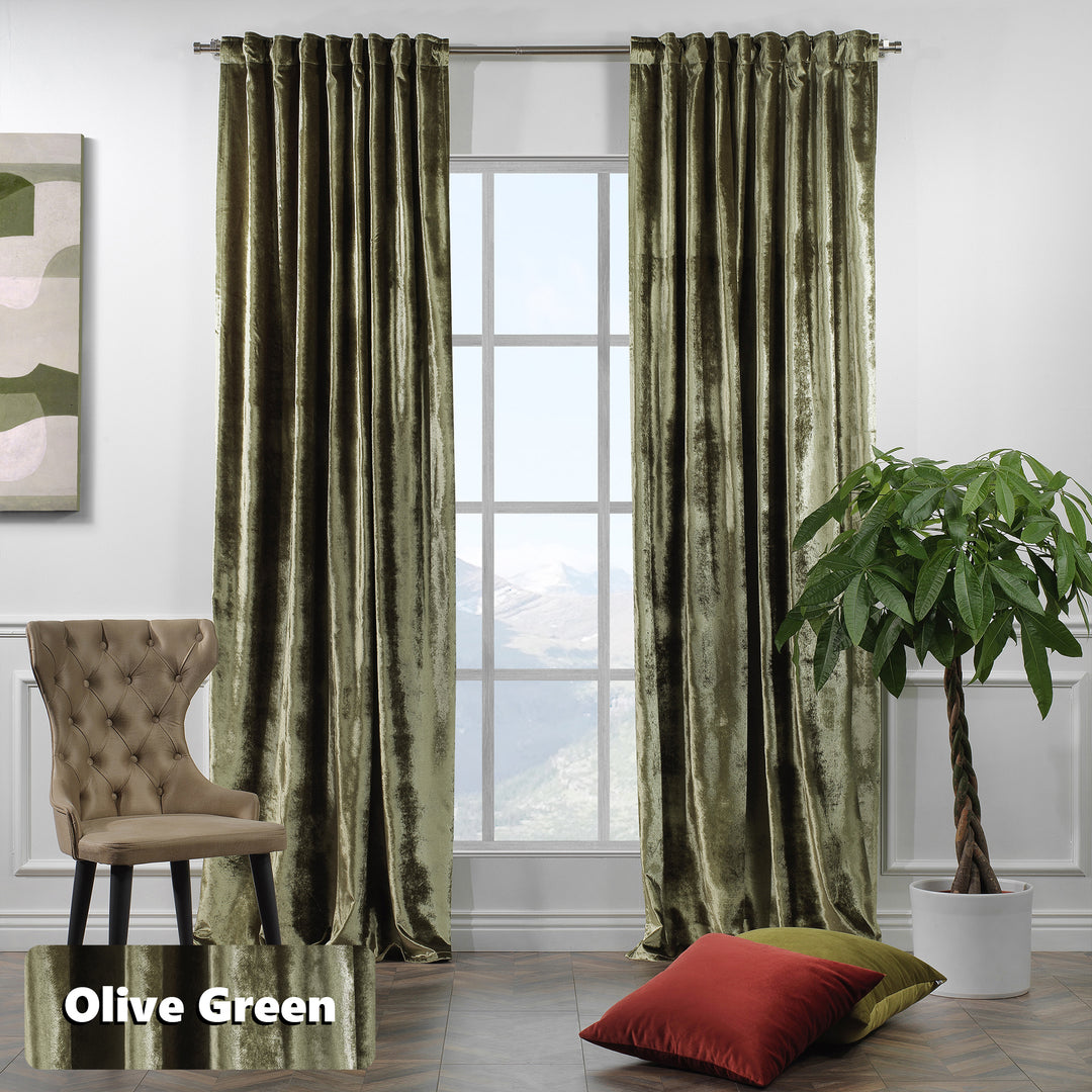 Extra‑long matte velvet eyelet curtain with soft folds and a contemporary ring finish.
