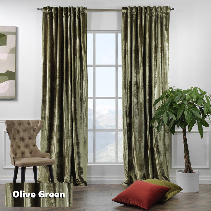 Extra‑long matte velvet eyelet curtain with soft folds and a contemporary ring finish.