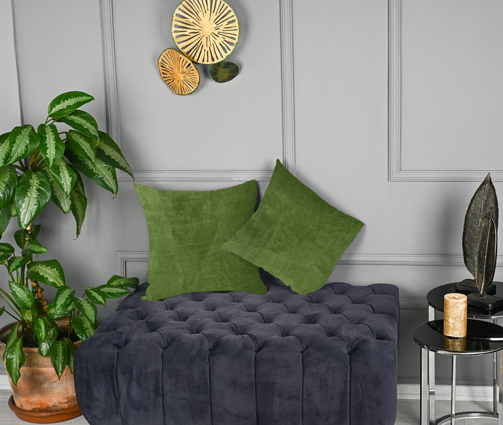 A made to measure cushion cover in muted olive‑green matte velvet, shown with a smooth plush texture and crisp seams for a natural refined finish
