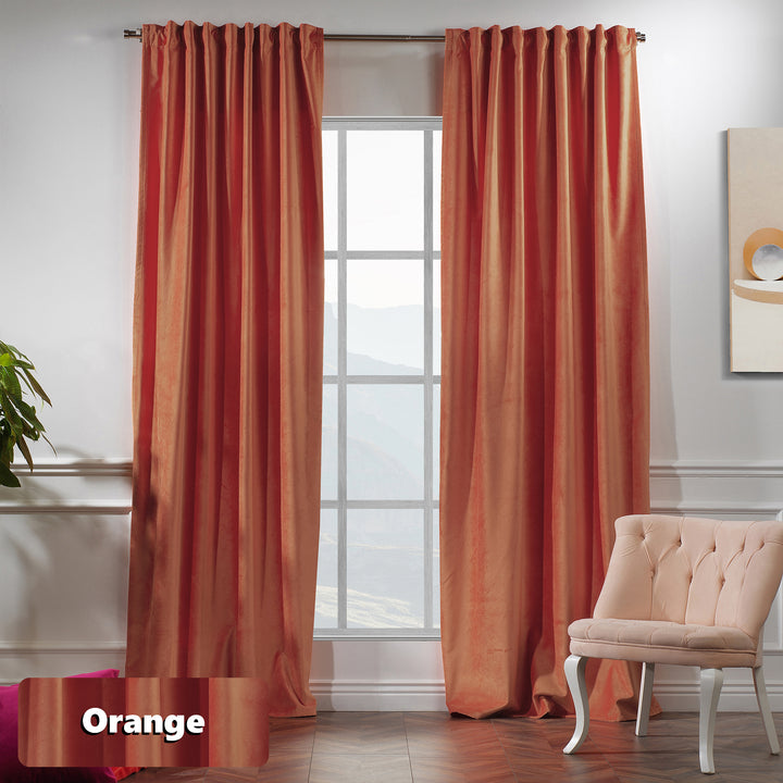 Bright orange matte velvet curtain with wide coverage and soft, modern texture