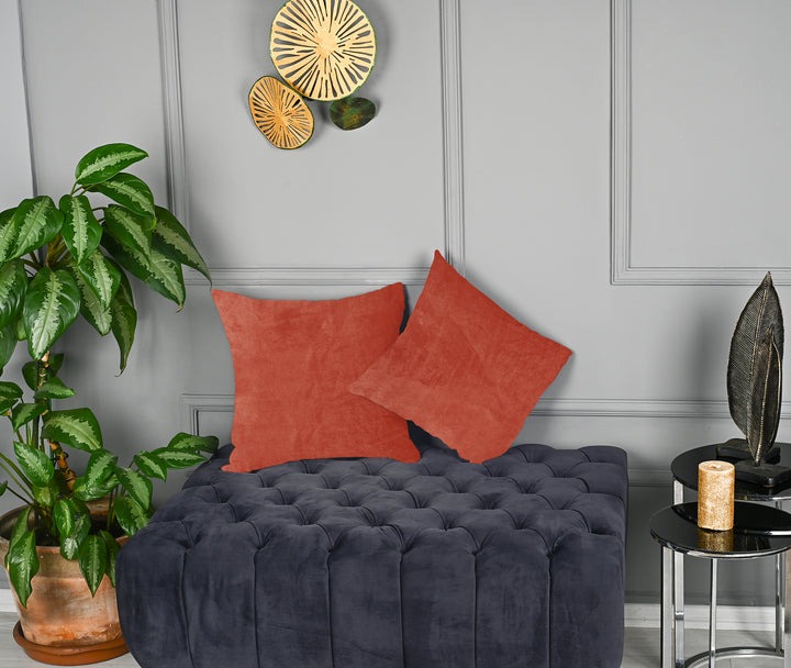 A made to measure cushion cover in soft orange matte velvet, shown with a smooth plush texture and clean structured edges for a bright modern finish