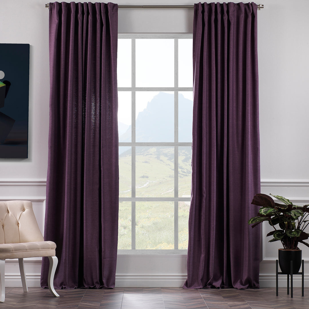A made to measure linen‑look curtain in deep purple, shown in daylight with soft textured weave and a premium tailored drape