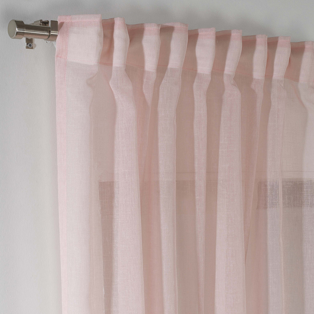 Detailed view of pink linen sheer texture, natural fibres and sheer finish.