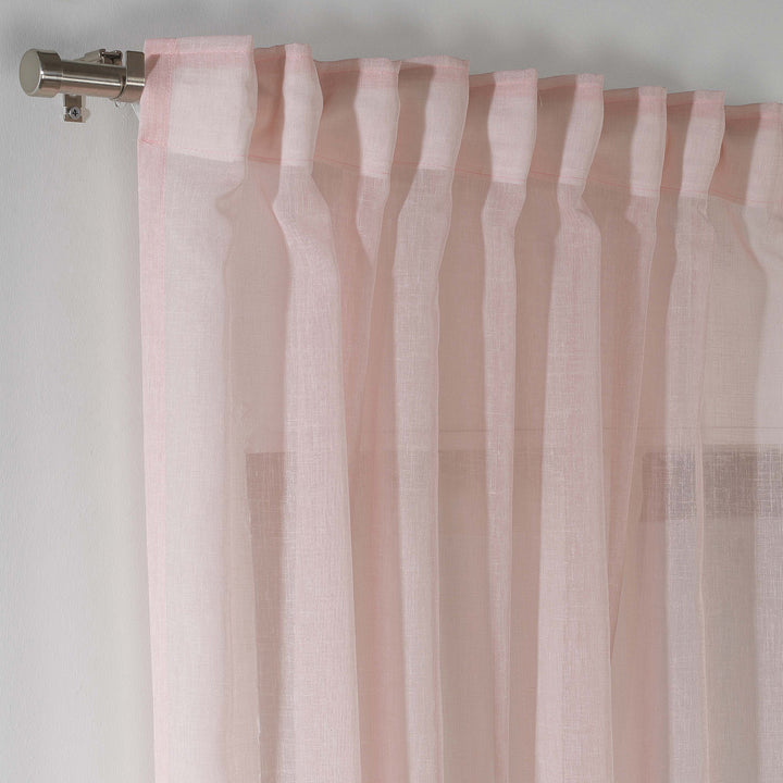 Detailed view of pink linen sheer texture, natural fibres and sheer finish.