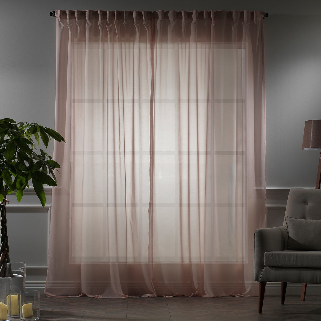 Made‑to‑measure extra‑long and extra‑wide Pink silk‑crepe sheer curtain in evening light, highlighting the fine crepe weave and gentle soft‑glow translucency.