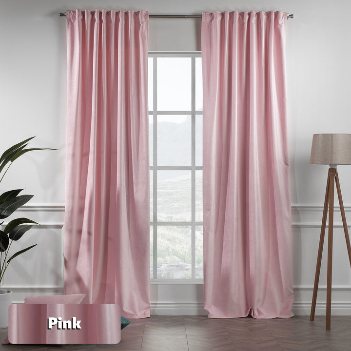 Extra‑long extra‑wide pink matte velvet curtain hanging on window, smooth matte finish, luxury tailored look.