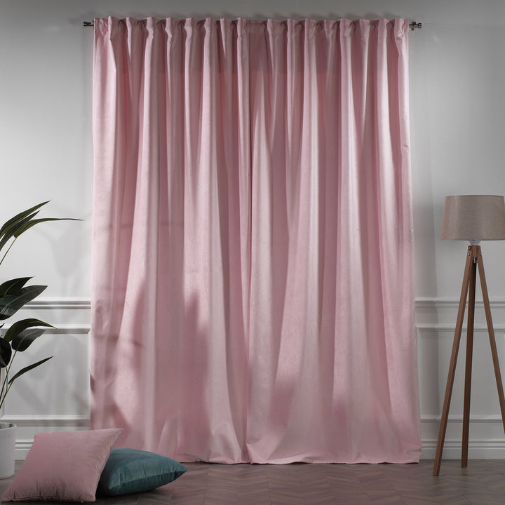 Pink matte velvet eyelet curtains styled on curtain pole, extra‑long drop, elegant matte velvet flow.