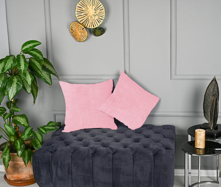 A made to measure cushion cover in classic soft‑pink matte velvet, featuring a velvety surface and neatly tailored seams for a gentle premium appearance