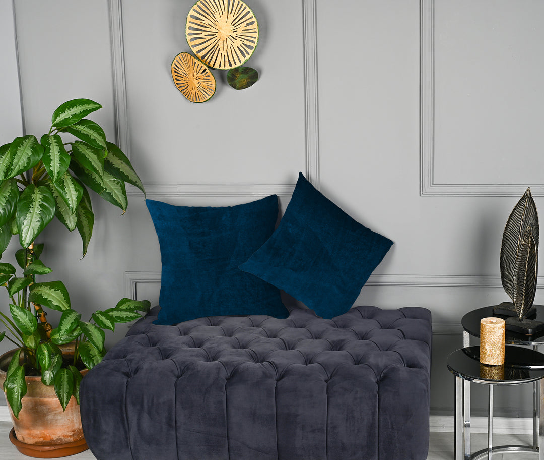 A made to measure cushion cover in deep prussian‑blue matte velvet, featuring a velvety surface and crisp structured edges for a bold sophisticated look