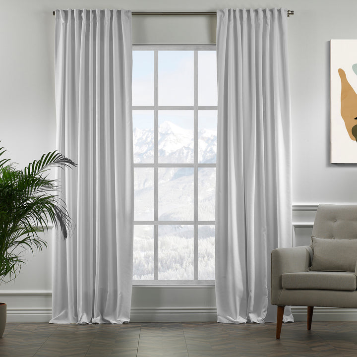 Pure white velour curtains in full view, highlighting smooth pile texture, crisp tone and premium made‑to‑measure fall.