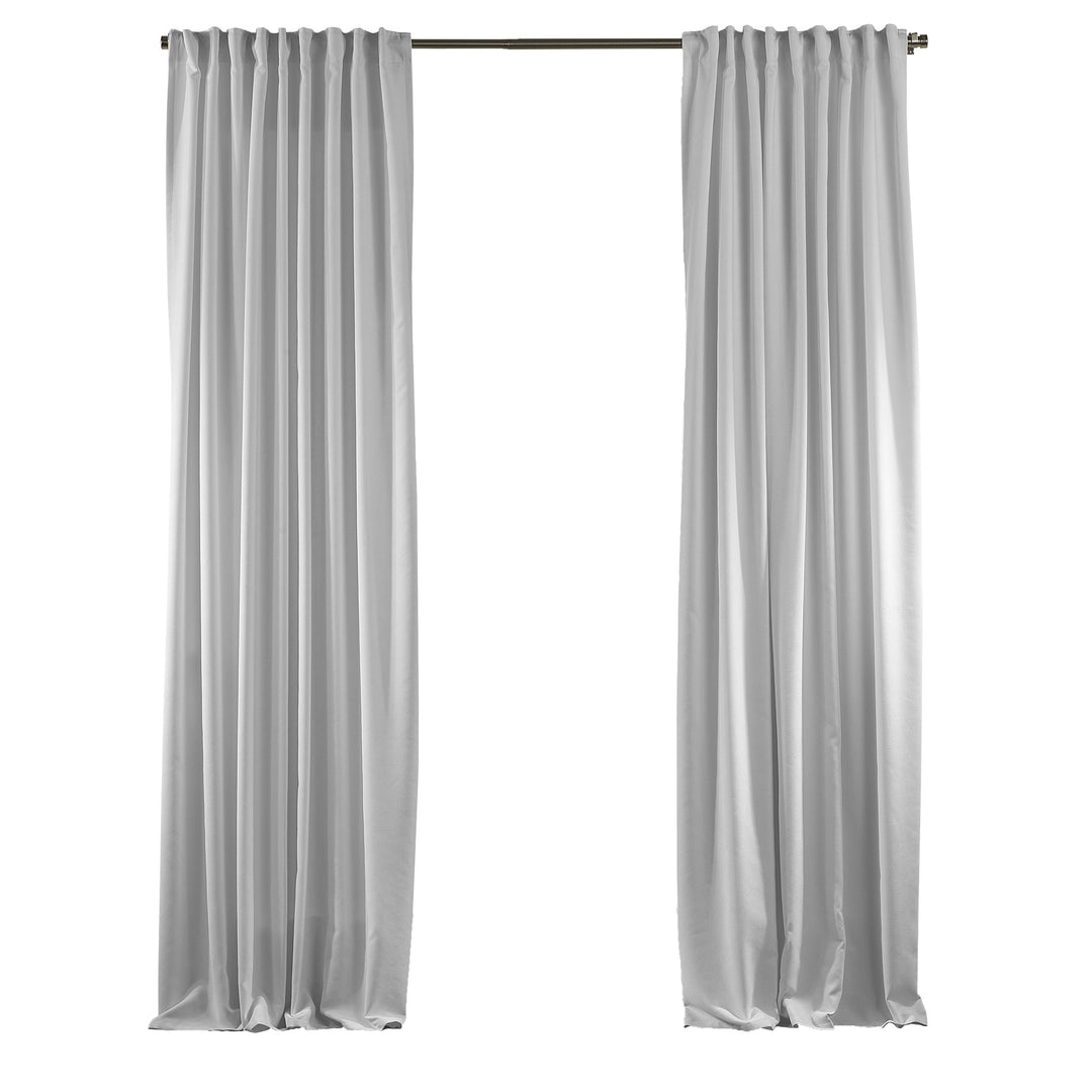 Pure white velour curtains displayed without accessories, highlighting clean matte texture and smooth tailored drape.