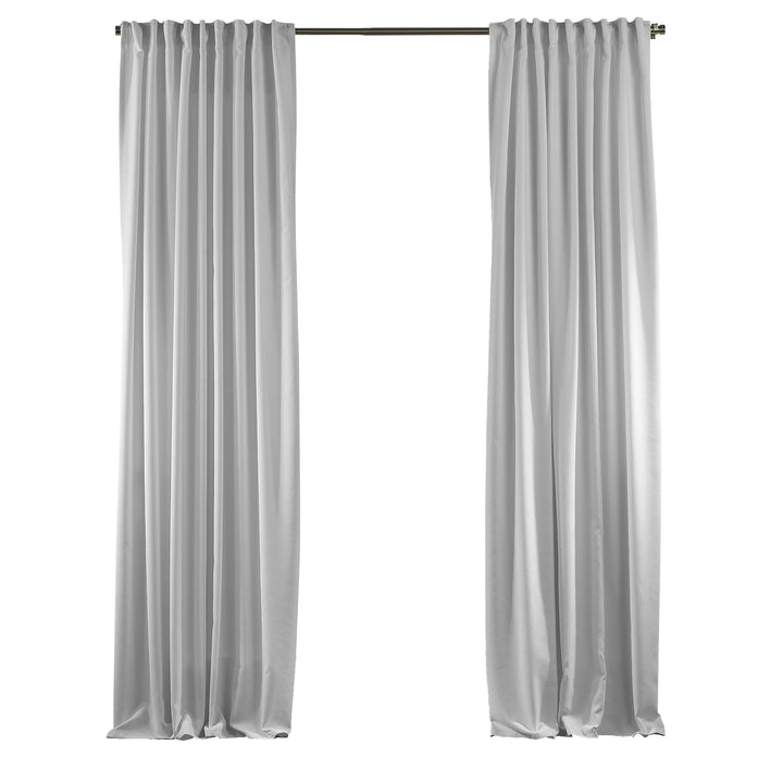 Pure white velour curtains displayed without accessories, highlighting clean matte texture and smooth tailored drape.