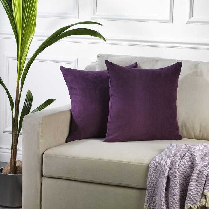 A made to measure cushion cover in deep purple velour, featuring a smooth lightweight surface and clean seams for a rich refined finish