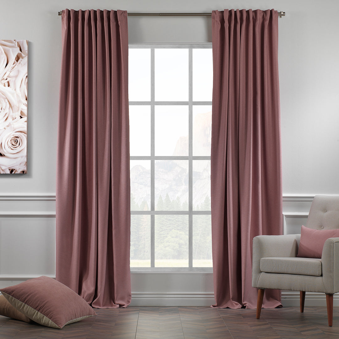 A made to measure linen‑look curtain in rose pink, photographed in daylight with soft woven texture and elegant natural drape