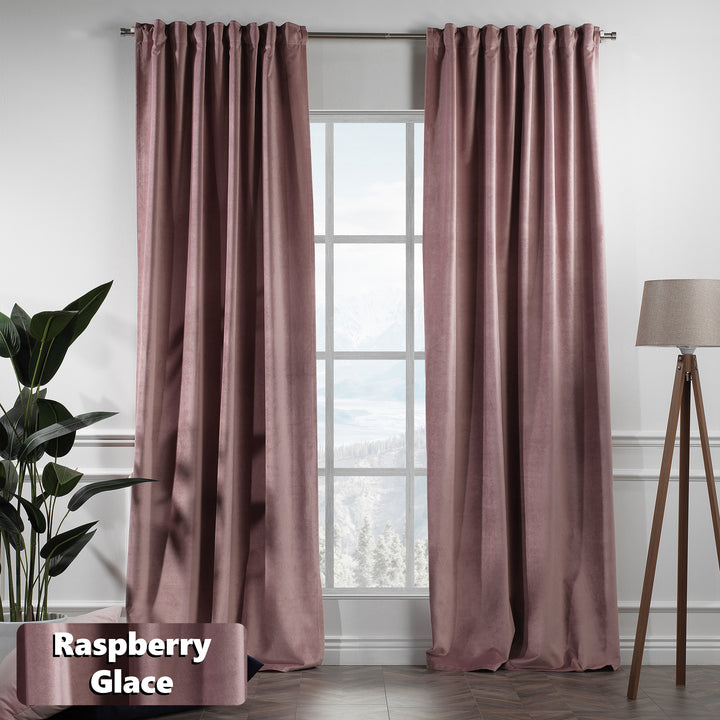 Extra‑long extra‑wide raspberry matte velvet curtains hanging on window, blackout effect, elegant full coverage.