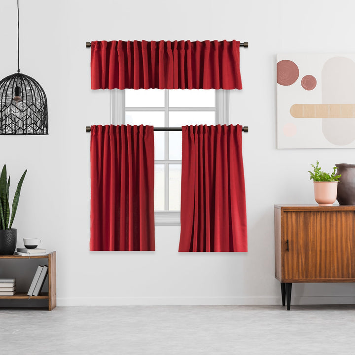 A made to measure kitchen valance in classic red velour, shown with a lightweight plush texture and clean structured seams for a bold decorative finish