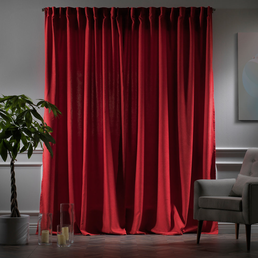Red velour curtains photographed at night, showing deep warm tone, dense weave and refined matte finish, made to measure 