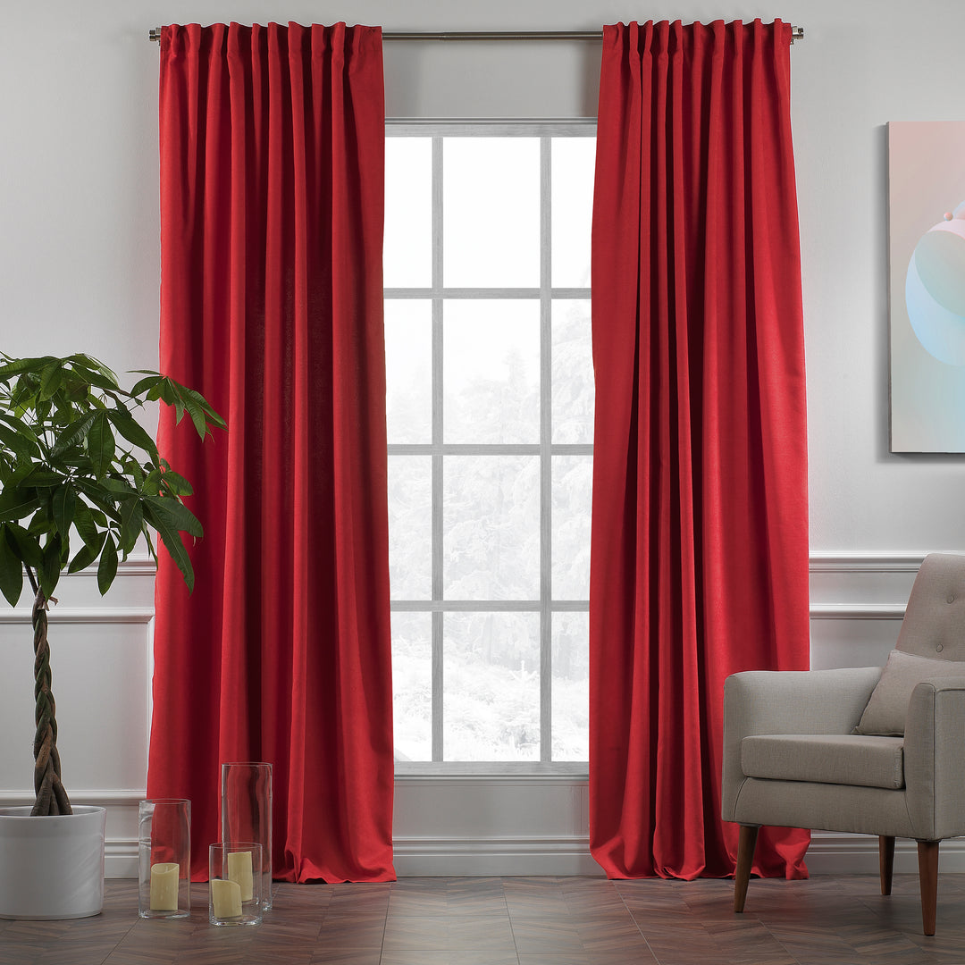 Red velour curtains shown in daylight, highlighting rich saturated tone, smooth pile texture and elegant drape, made to measure and available by the metre.