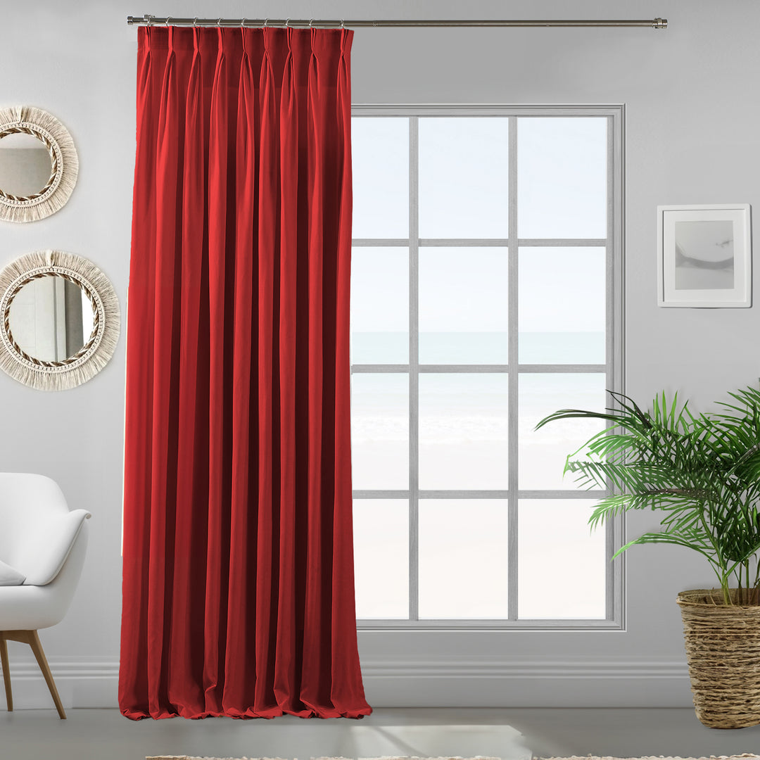 Pinch pleated a single red velour curtain panel showing soft drape, smooth pile and premium matte texture, made to measure 