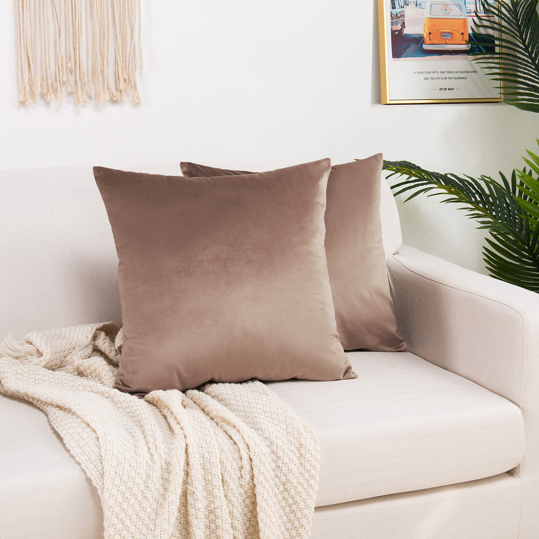 A made to measure cushion cover in soft ivory‑cream shiny velvet, featuring a gentle glossy sheen and neatly finished seams for a light premium finish