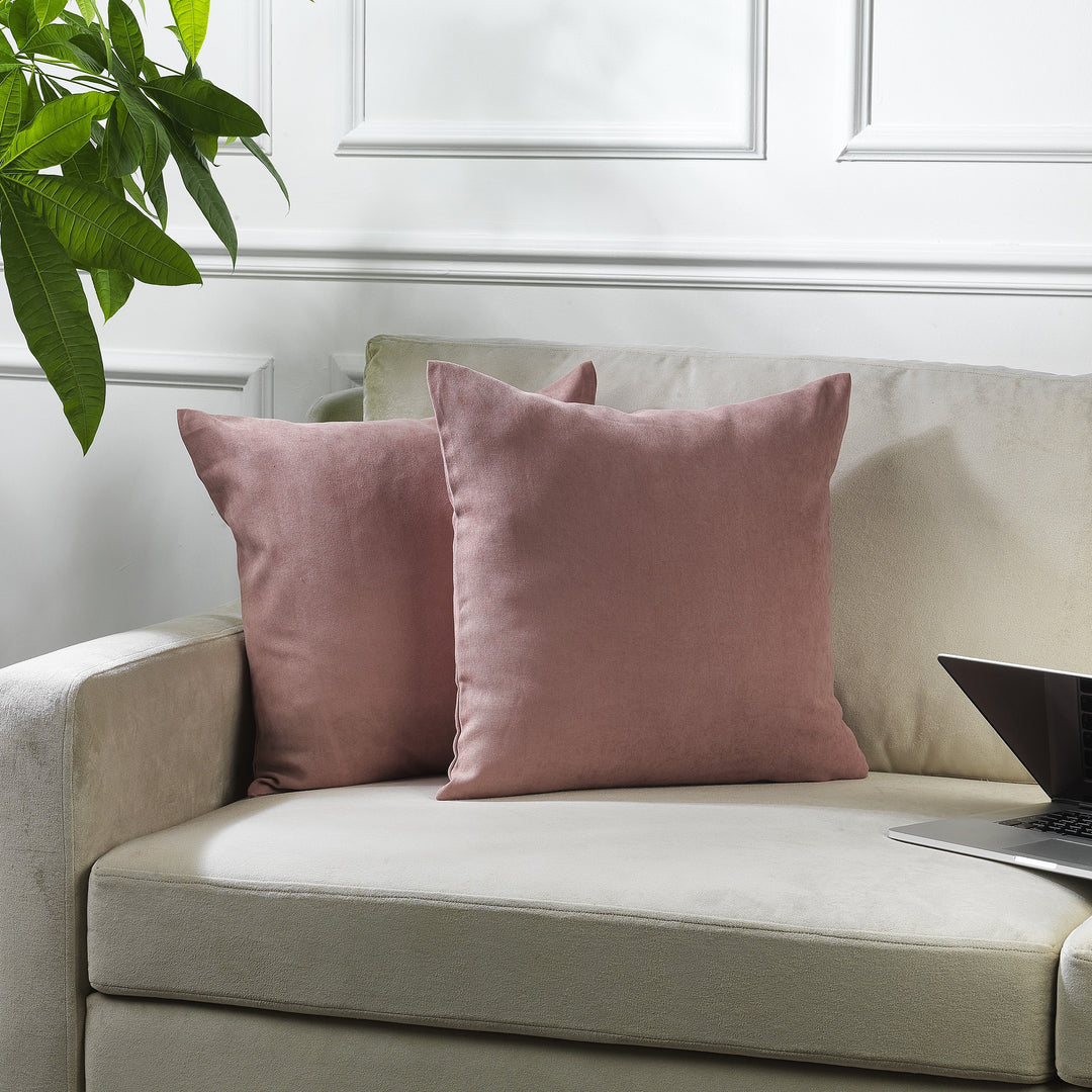 A made to measure cushion cover in soft rose‑pink velour, shown with a plush lightweight texture and neatly finished edges for a delicate elegant look