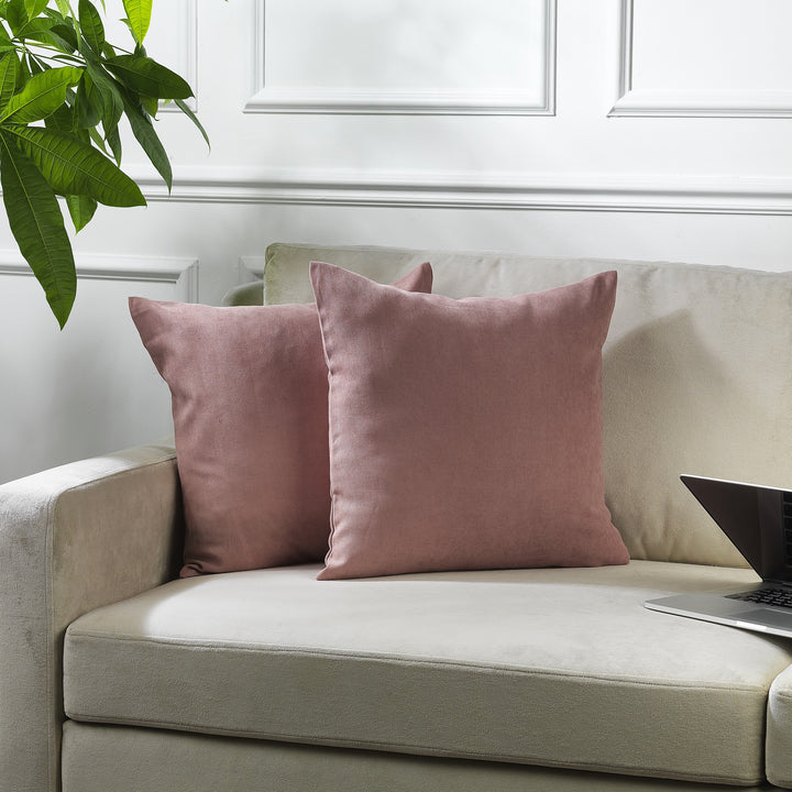 A made to measure cushion cover in soft rose‑pink velour, shown with a plush lightweight texture and neatly finished edges for a delicate elegant look