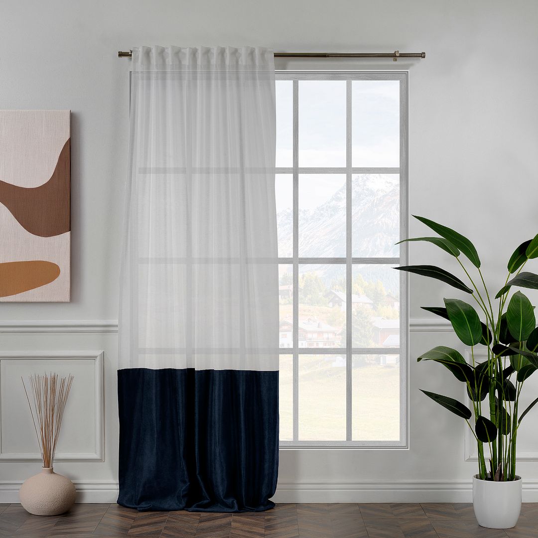 A made to measure royal blue velvet and sheer block curtain, featuring deep colour contrast, soft folds and a premium layered look