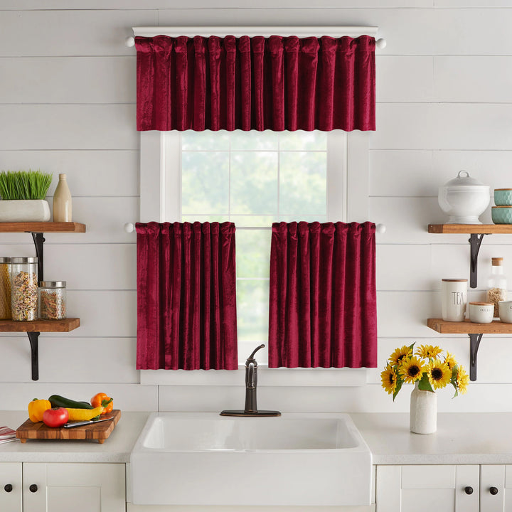 A made to measure valance in vibrant ruby‑red shiny velvet, featuring a glossy plush texture and clean seams for a striking elegant look
