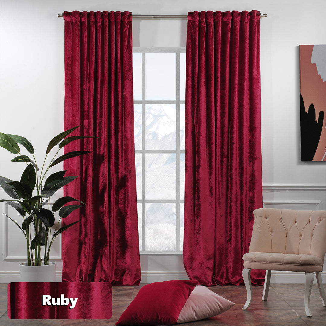 Shiny velvet eyelet curtain with a sleek reflective finish and long, fluid ring‑top movement.