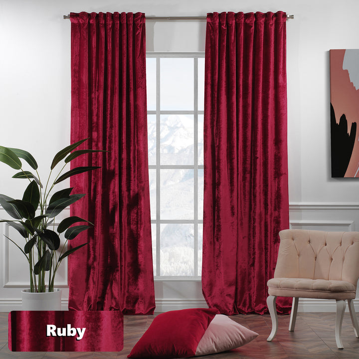 Shiny velvet eyelet curtain with a sleek reflective finish and long, fluid ring‑top movement.