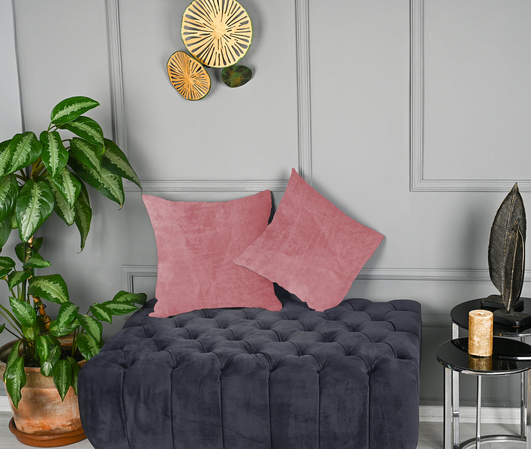 A made to measure cushion cover in warm dusty‑pink matte velvet, displaying a soft velvety surface and neatly finished seams for a refined feminine look
