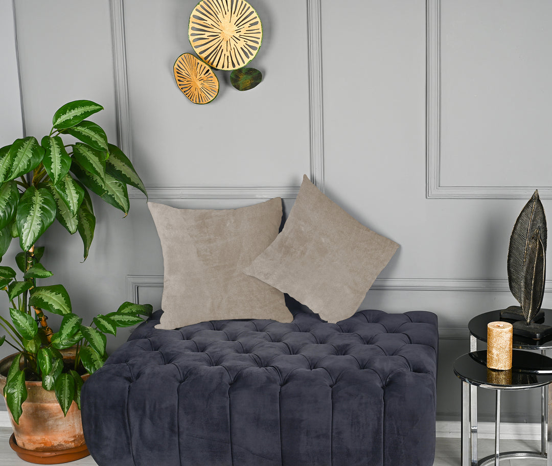 A made to measure cushion cover in warm seashell‑white matte velvet, displaying a soft plush texture and neatly finished seams for a refined appearance