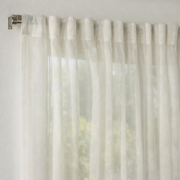 Made‑to‑measure extra‑long and extra‑wide sheer silk‑crepe curtain with ultra‑fine texture and soft flowing translucency.