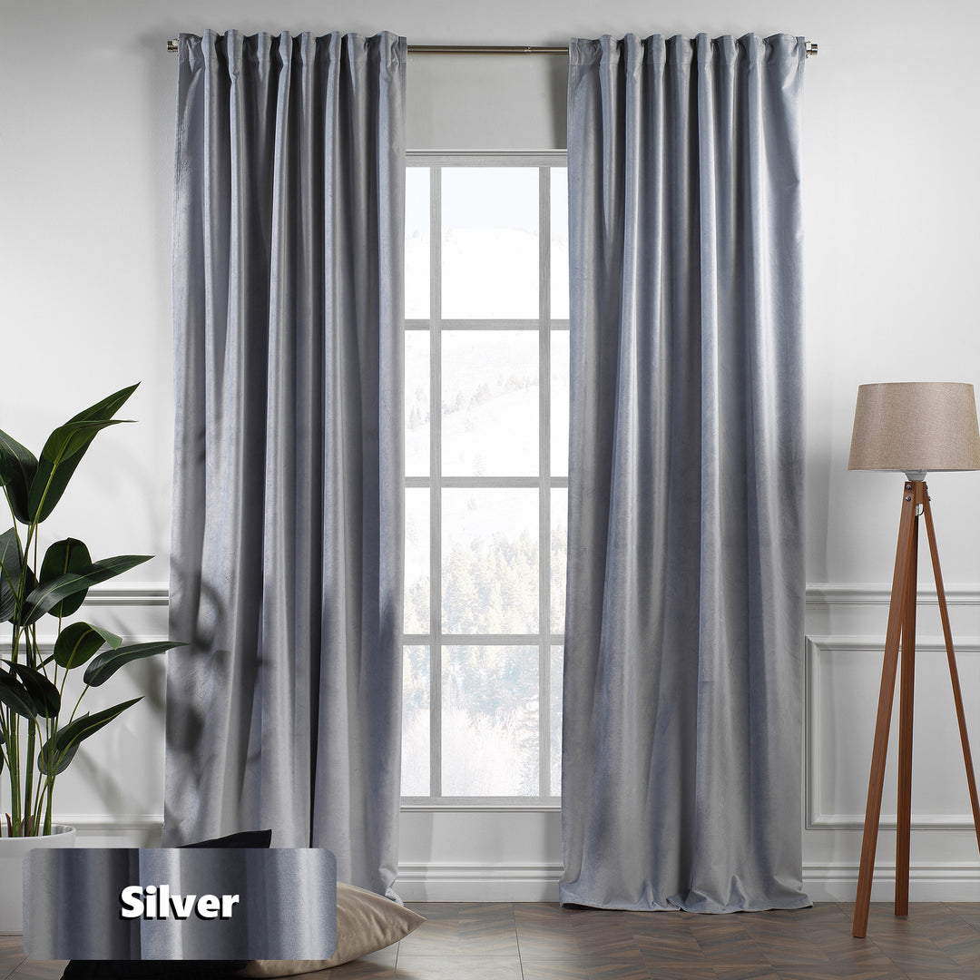 Eyelet‑top silver matte velvet curtain panel sliding smoothly on a pole, wide coverage and soft texture.