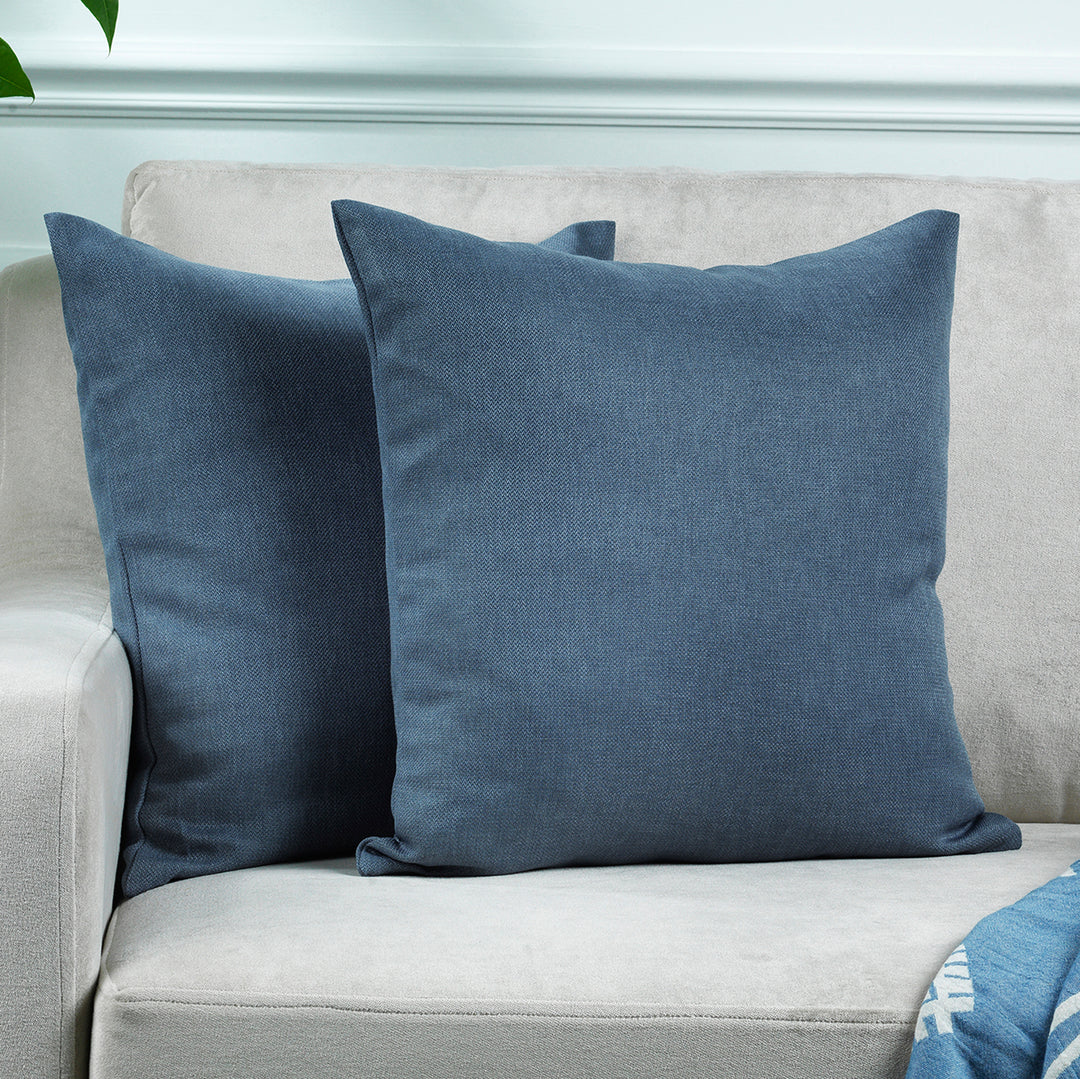 A made to measure cushion cover in soft sky‑blue linen‑look fabric, shown with a natural woven texture and neatly tailored edges for a fresh refined finish