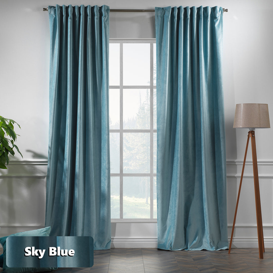 Sky Blue eyelet header matte velvet curtain with extended length and a relaxed, premium flow.