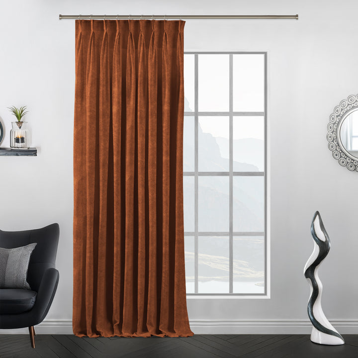 Terracotta‑inspired pinch pleat velvet curtain with tailored folds.