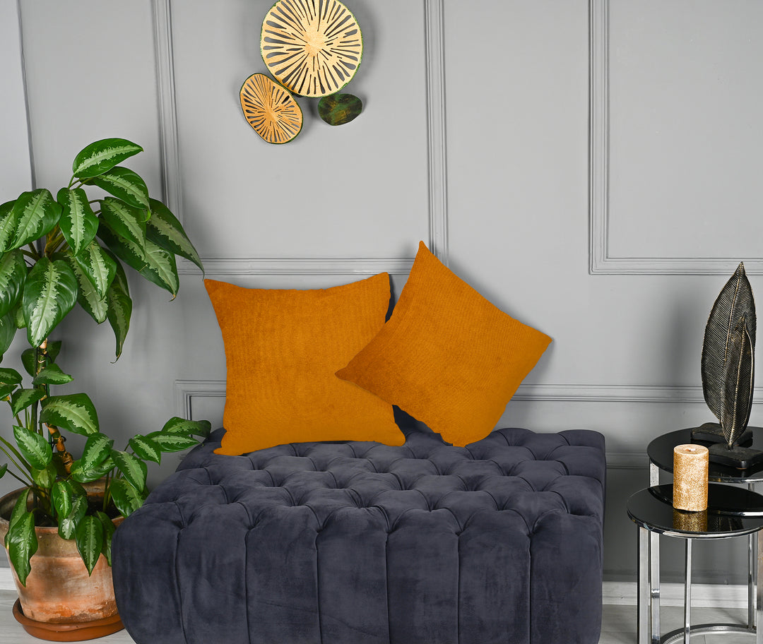 A made to measure cushion cover in burnt‑orange matte velvet, featuring a soft velvety surface and clean refined seams for a warm contemporary look