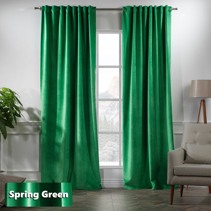Extra‑long matte velvet eyelet curtain with soft folds and a contemporary ring finish.