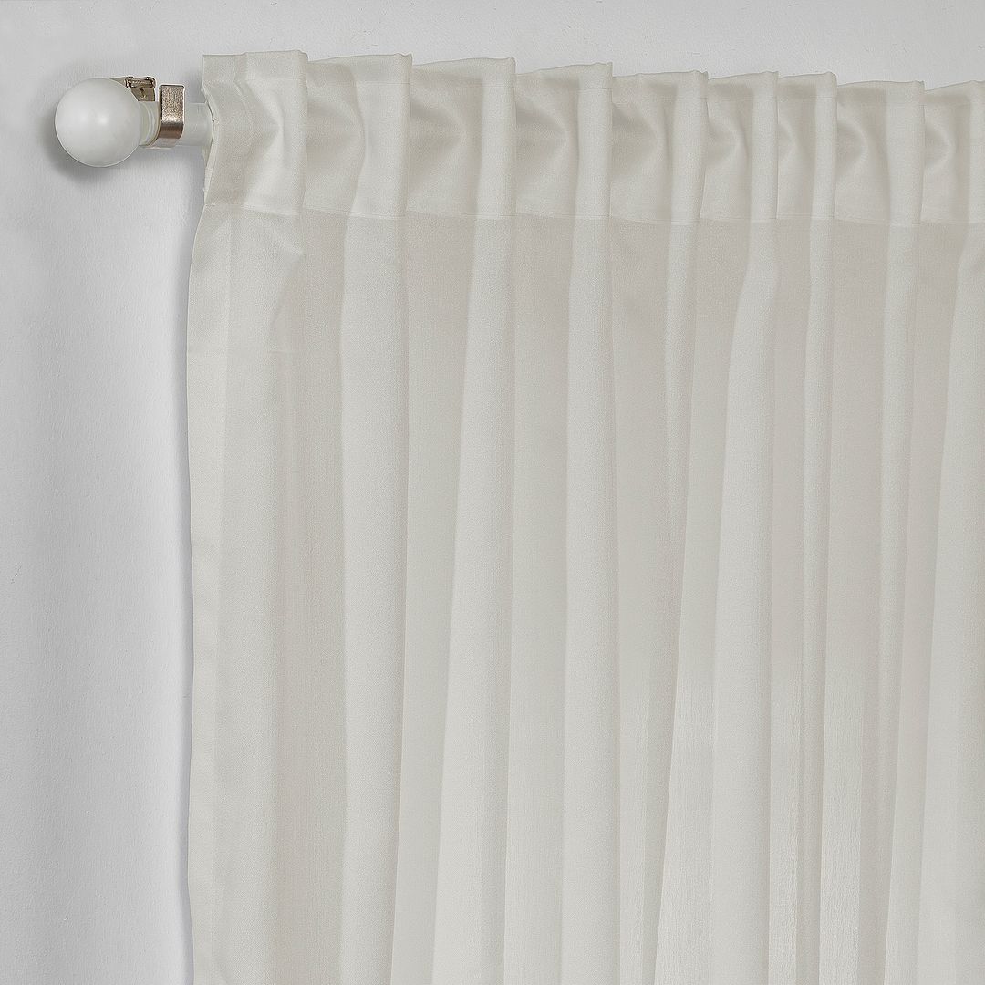 Macro close‑up of crepe semi‑sheer curtain fabric, highlighting the fine crepe grain, open weave structure and softly diffused natural light, made to measure.