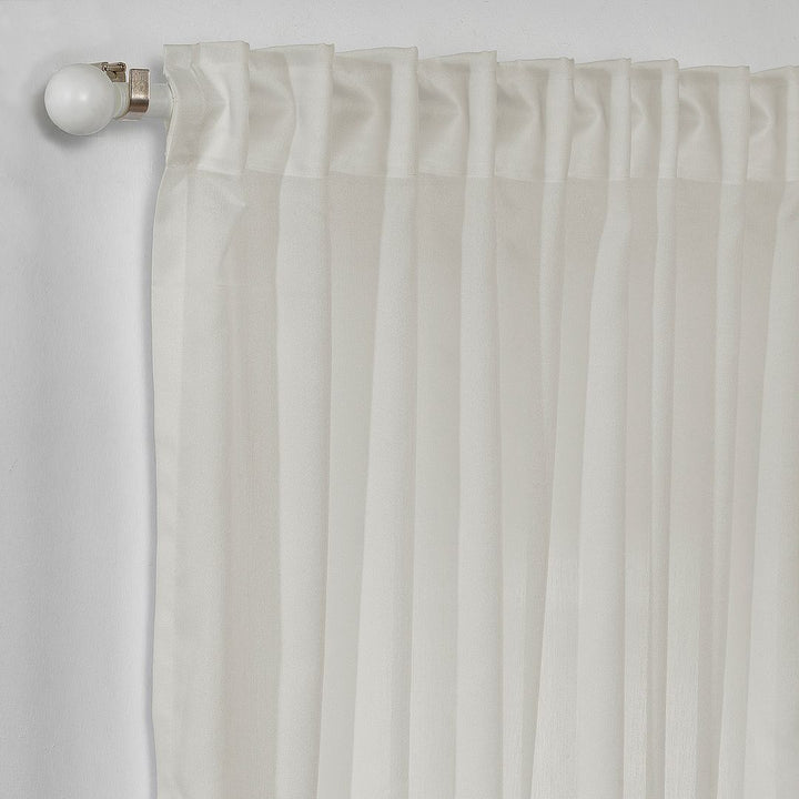 Macro close‑up of crepe semi‑sheer curtain fabric, highlighting the fine crepe grain, open weave structure and softly diffused natural light, made to measure.