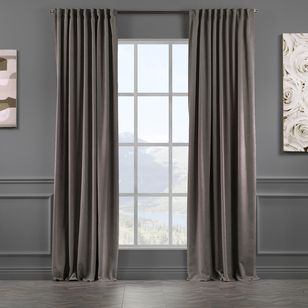 Stone velour curtains against dark background, highlighting fabric depth, matte finish and elegant drape, made to measure and available by the metre.