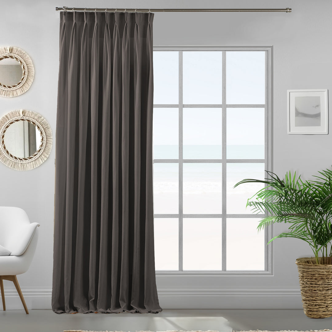 Pinch pleated single stone velour curtain panel showing soft drape, smooth pile and refined tailored fall, made to measure
