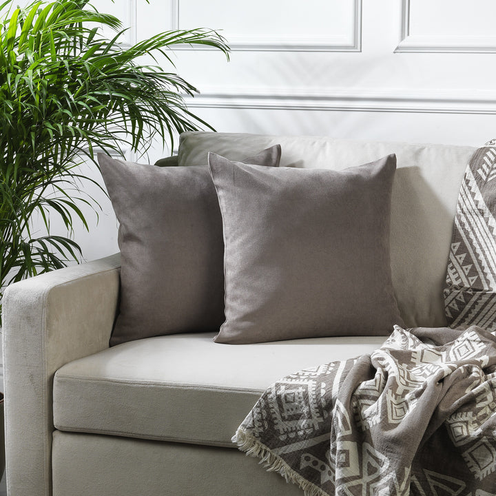 A made to measure cushion cover in warm stone‑beige velour, featuring a soft lightweight surface and neatly tailored seams for a refined neutral look