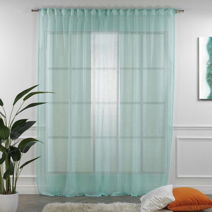 Blue‑green linen sheer curtain fully closed in a modern living room, cool airy folds and natural linen weave.