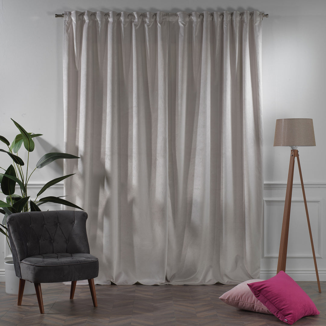 Extra‑long extra‑wide matte velvet curtain hanging on window, smooth matte finish, luxury tailored look.