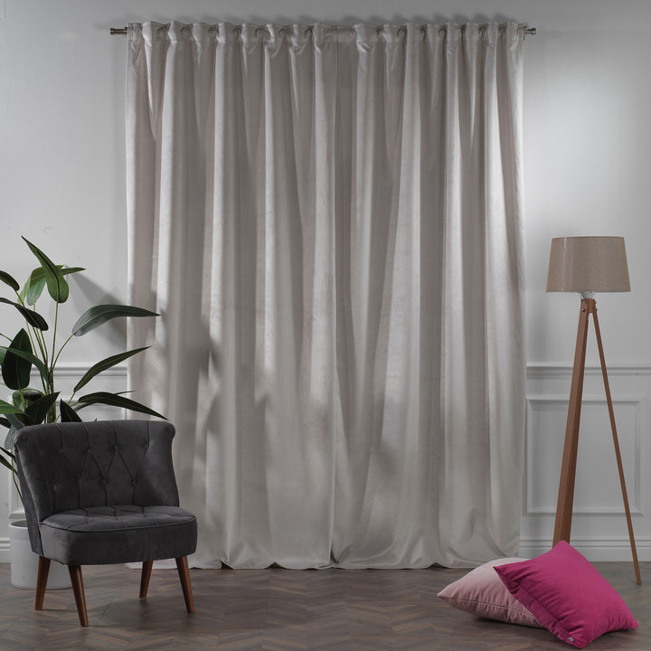 Extra‑long extra‑wide matte velvet curtain hanging on window, smooth matte finish, luxury tailored look.