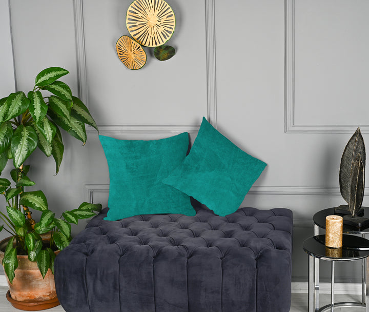 A made to measure cushion cover in bright turquoise matte velvet, displaying a velvety surface and neatly finished edges for a vibrant premium style