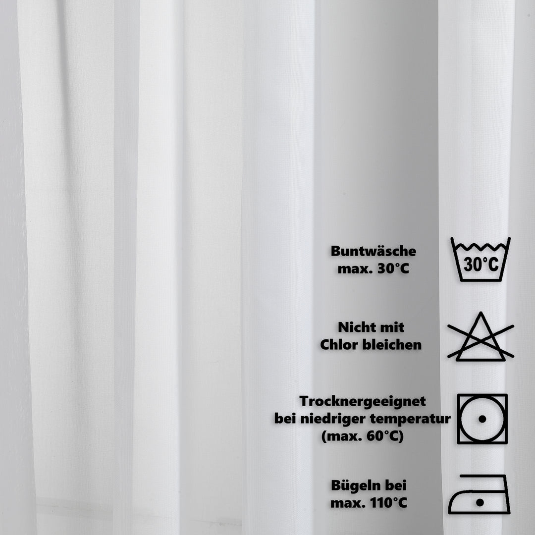 Close‑up silk washing label showing care instructions, fabric composition and premium textile maintenance details.