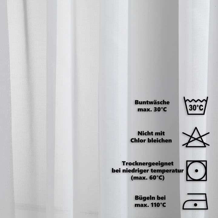 Close‑up silk washing label showing care instructions, fabric composition and premium textile maintenance details.